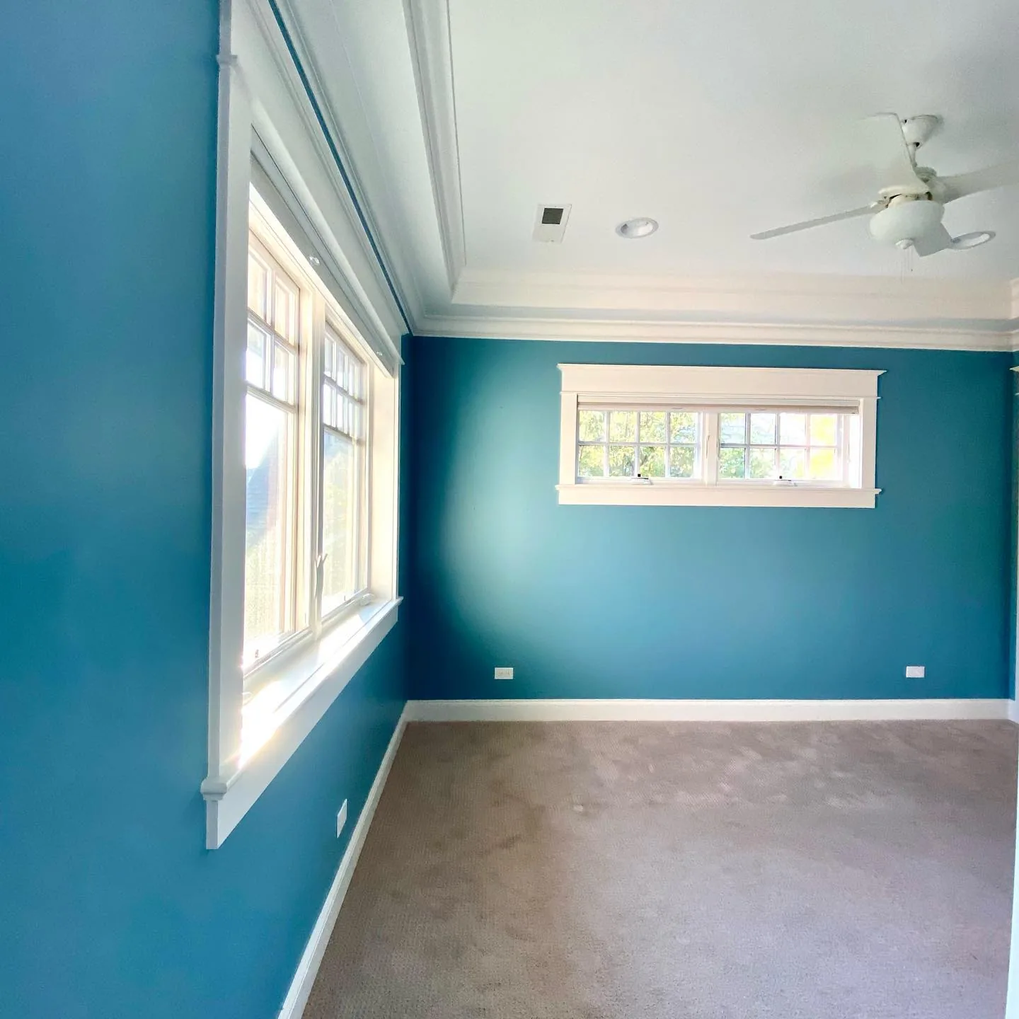 Interior painters applying premium paint to bedroom walls in a Chicago home